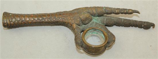 A Continental bronze loupe or magnifying glass, modelled as an eagles claw, 5.75in.